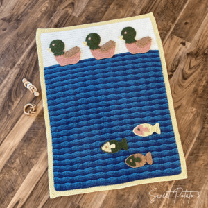 Read more about the article Duck Duck Fish Nursery Crochet Blanket Pattern