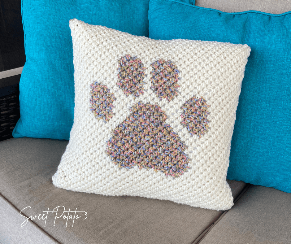Read more about the article Paw Print Crochet Pillow Cover Pattern